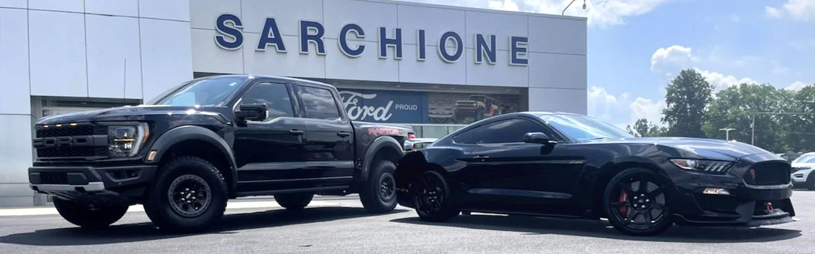 image of black ford mustang and black ford truck