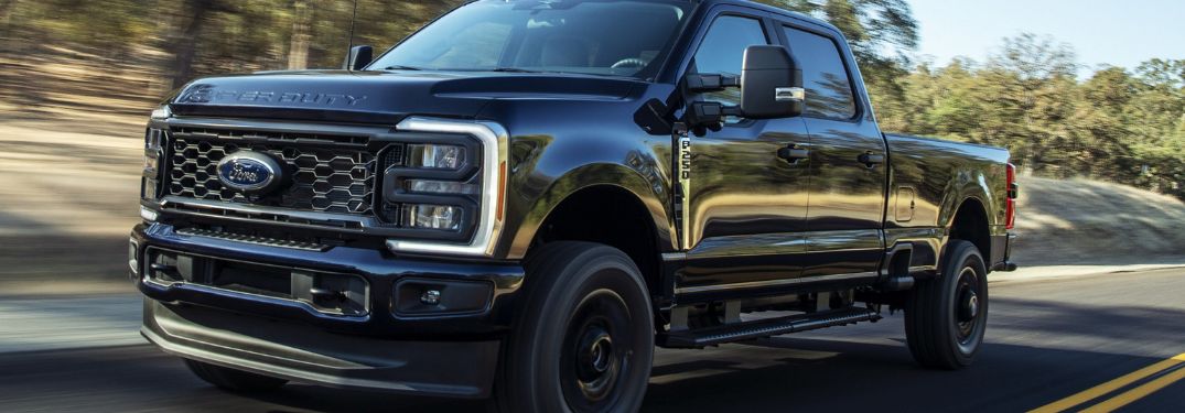 Black 2024 Ford Super Duty on a Country Highway