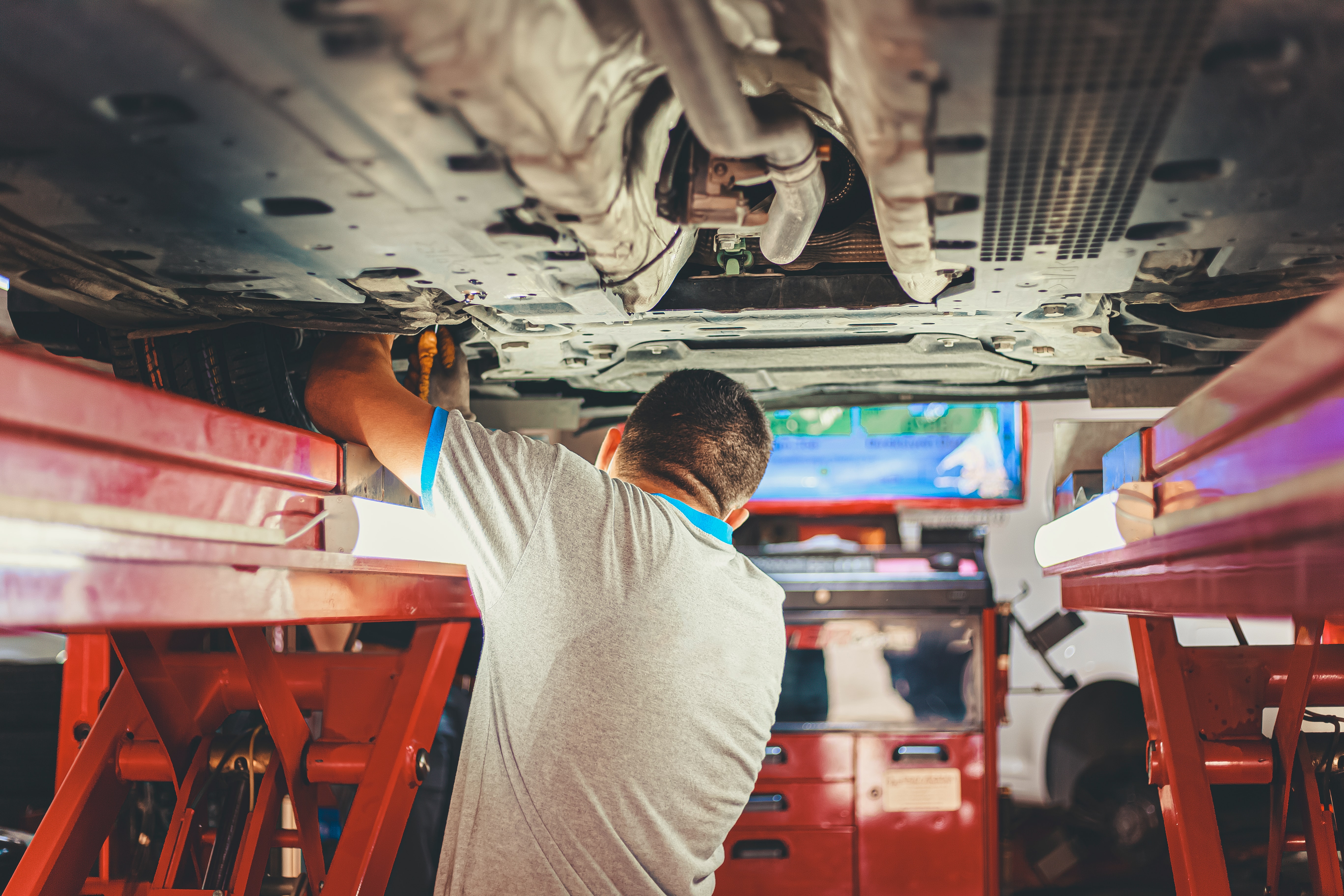 Man servicing a car