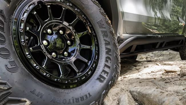 2024 GMC AT4X AEV off road, focus on 35-inch Goodyear Wrangler Territory MT tire