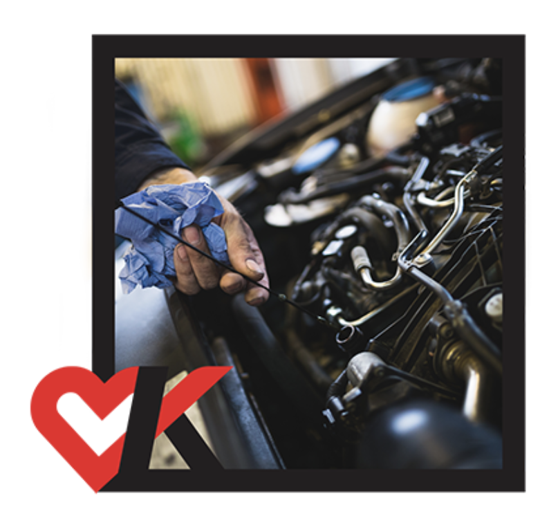 Man Servicing Oil in Engine