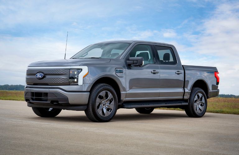 Gray 2024 Ford F-150 Lightning Flash Front Exterior on Country Road