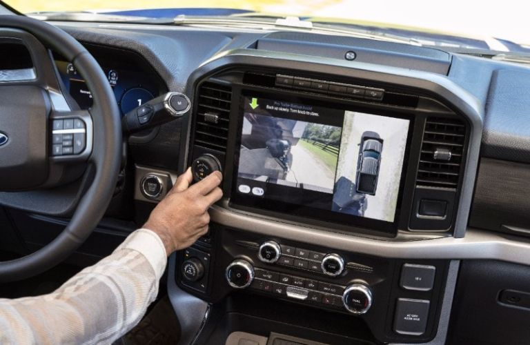 Man Using 2024 Ford F-150 Trailer Hitch Assist on Center Console