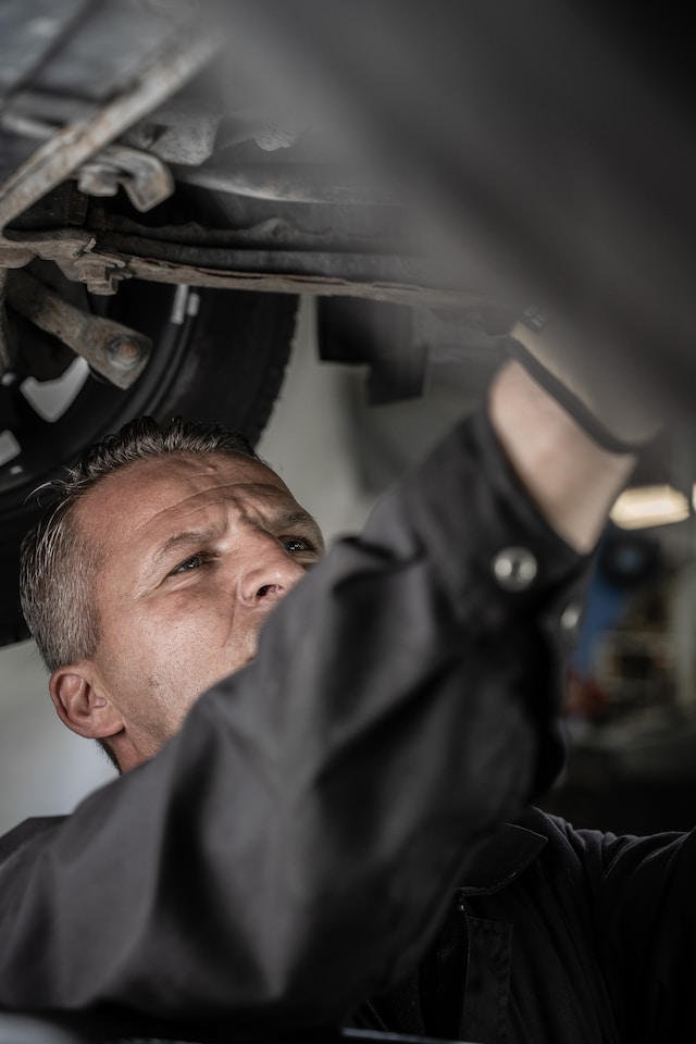 man working under car