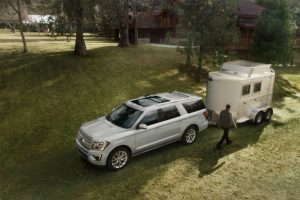 white 2019 Ford Expedition with trailer