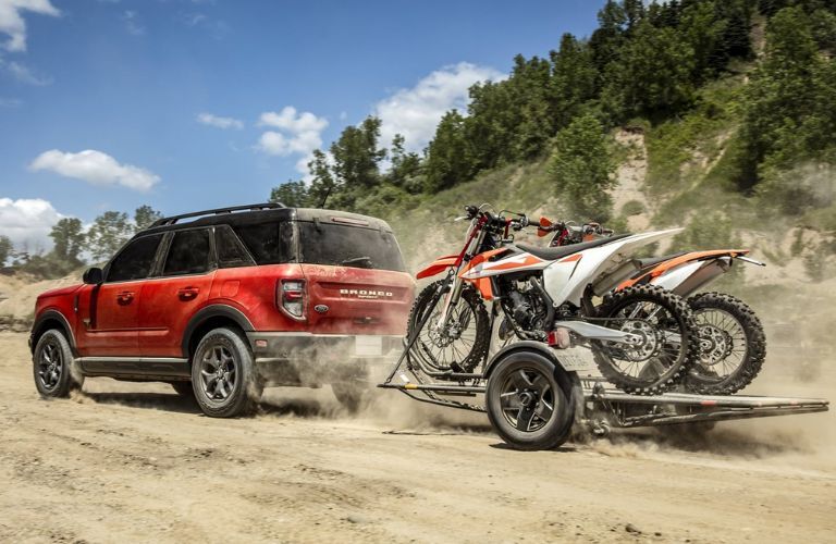 Red 2023 Ford Bronco Sport Towing Dirt Bikes