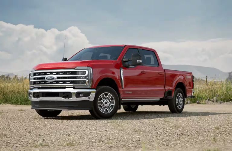 Race Red 2024 Ford Super Duty Front Exterior on a Farm