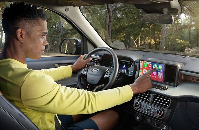 Man using 2022 Ford Maverick touchscreen 