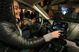 woman using the infotainment system in her 2018 Ford EcoSport