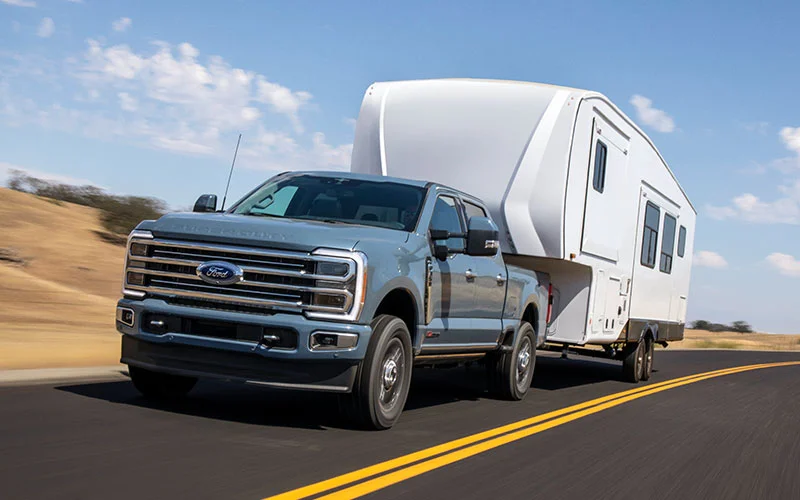 image of grey ford super duty towing camper