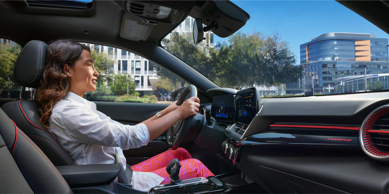 A woman driving the 2024 Chevrolet Equinox EV.