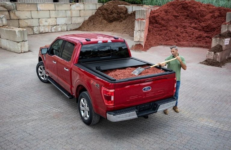 Red 2022 Ford F-150 Rear Exterior with Mulch in the Bed