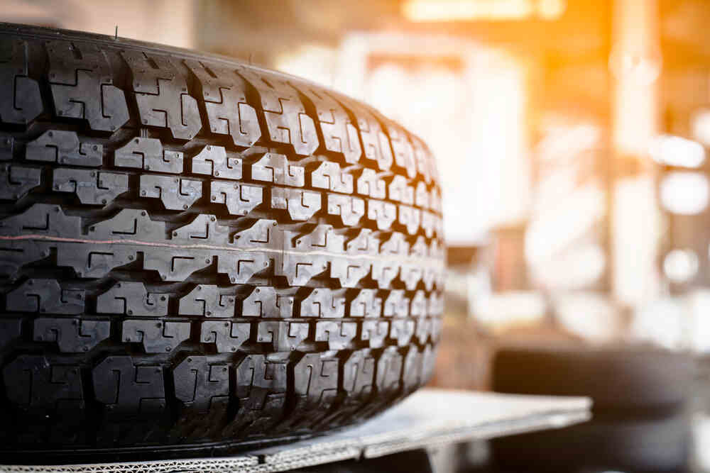 The surface of the pickup truck tire.
