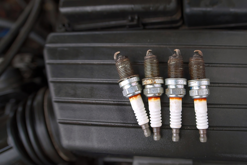 four used spark plugs