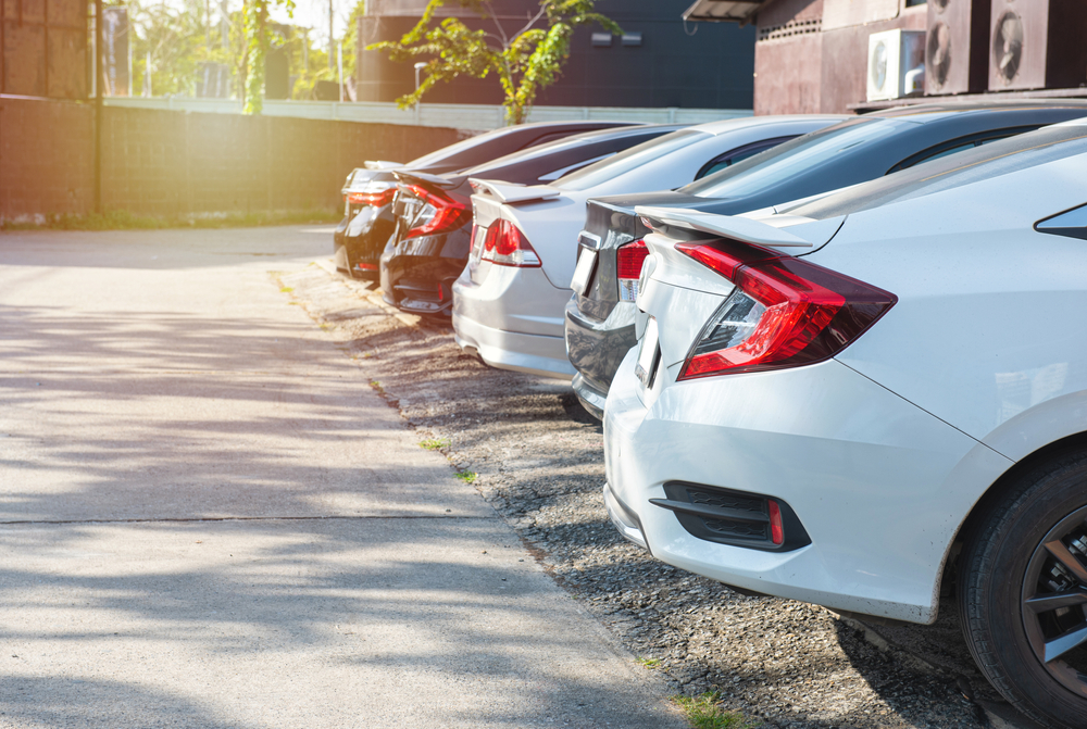 line of sedans parked n a row