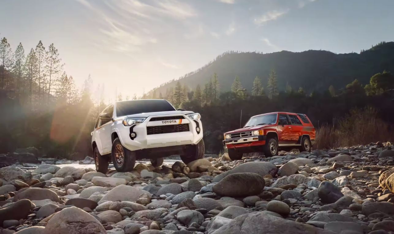 pictured left to right: white 2023 Toyota 4Runner, red 2023 Toyota 4Runner