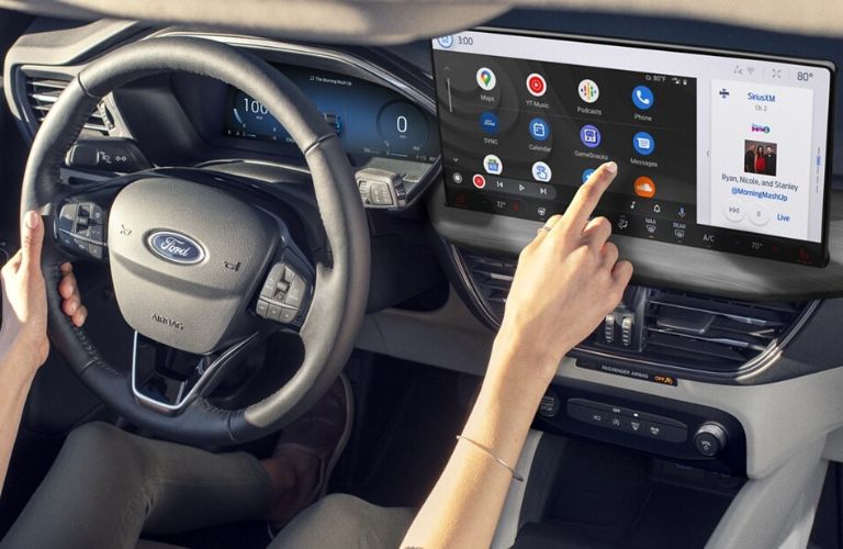 Woman Using Touchscreen Display in 2024 Ford Escape