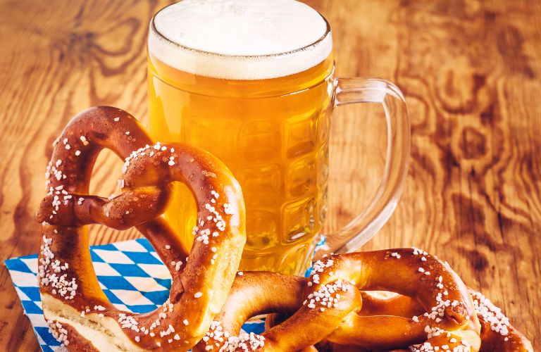 Close Up of a Beer Stein and Soft Pretzels