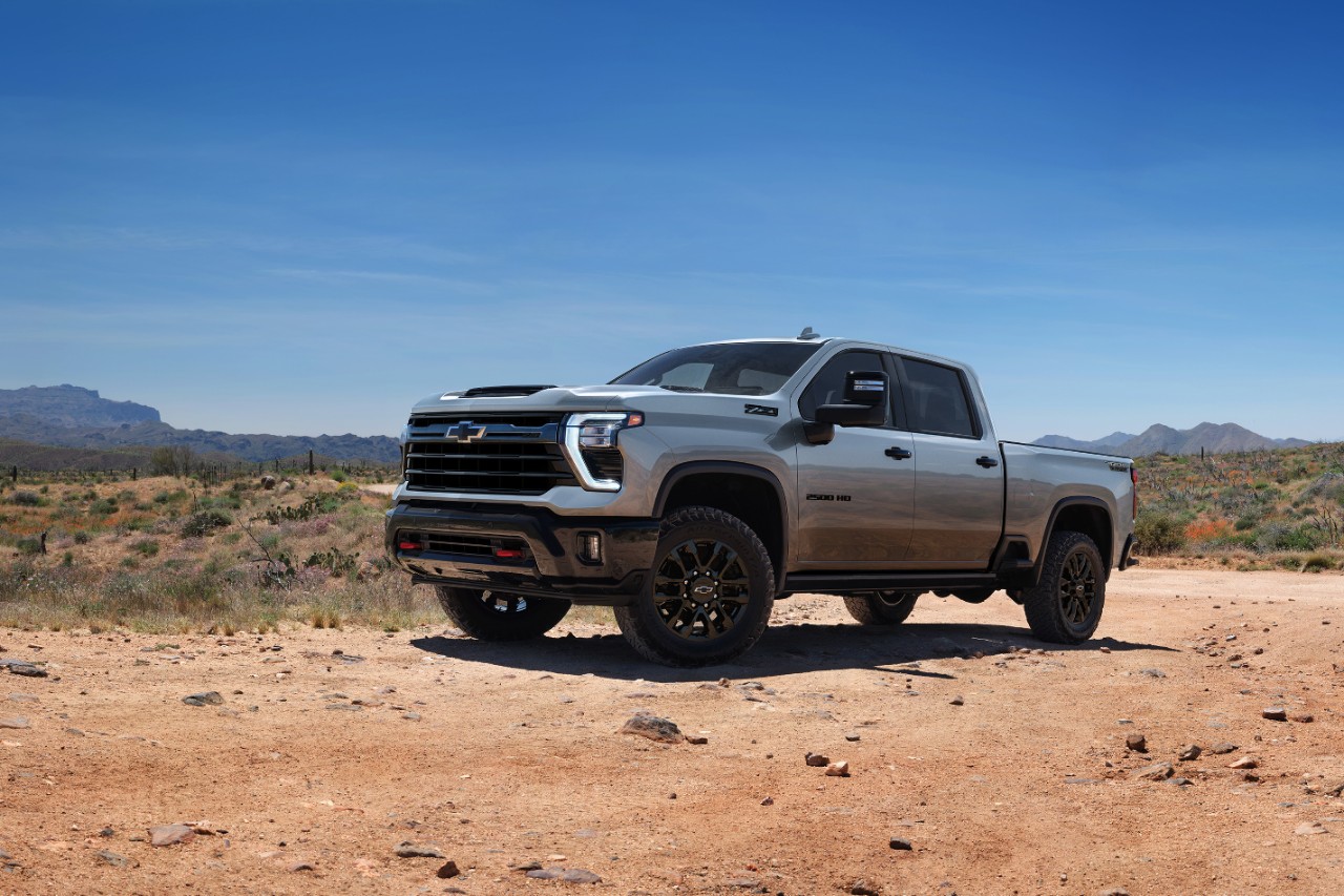 Side view of grey Chevrolet Silverado HD in desert. 