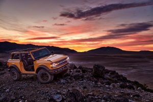side view of an orange 2021 Ford Bronco