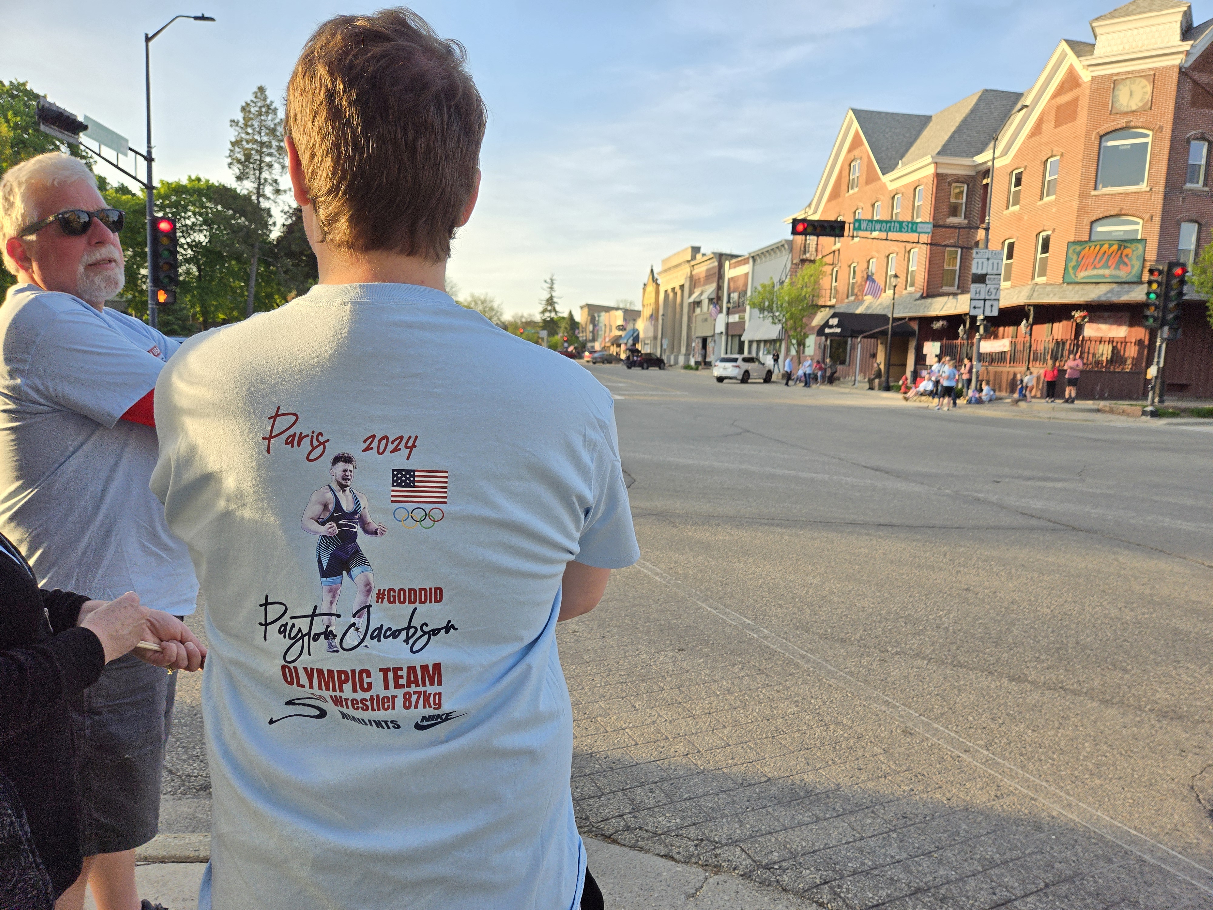 man wearing a Team Jacobson shirt at the Payton's Path to Paris parade