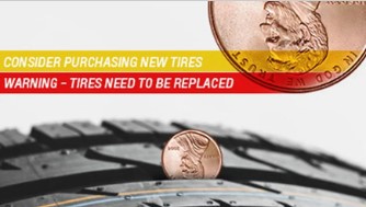 Text reads: Consider purchasing new tires;warning- tires need to be replaced