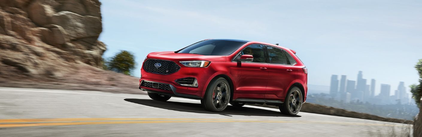 Red 2023 Ford Edge ST on a Freeway