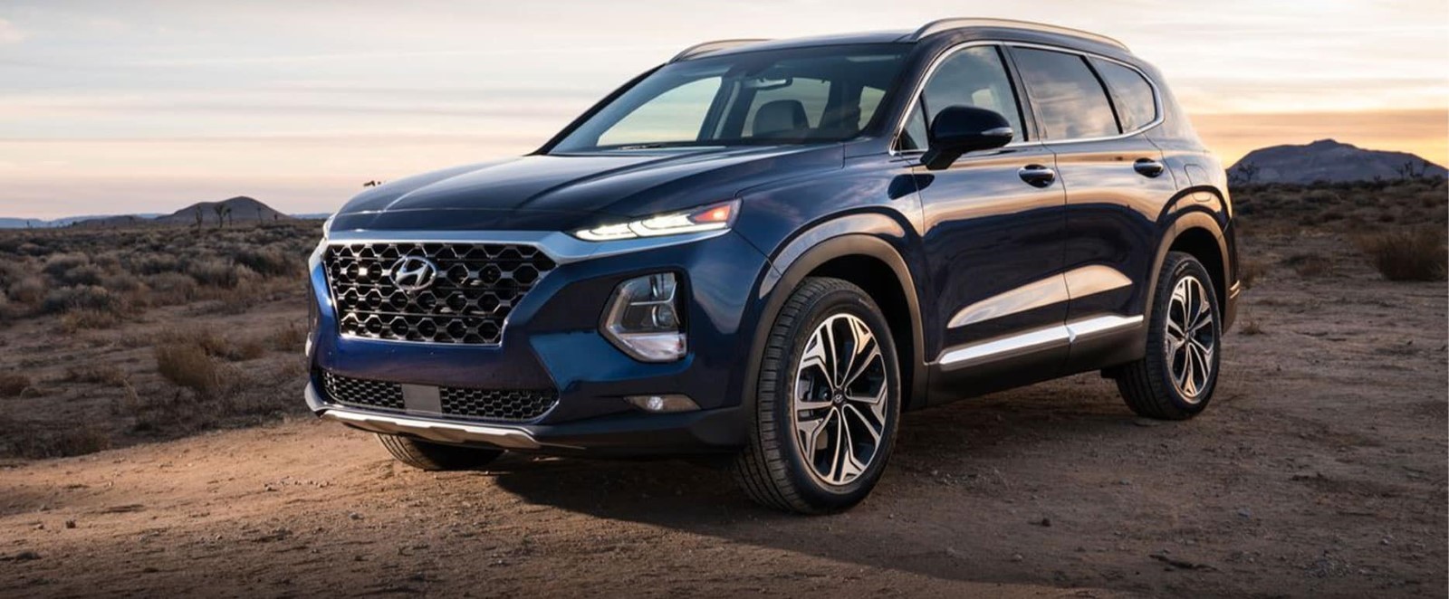 A navy 2020 Hyundai Santa Fe sitting parked.