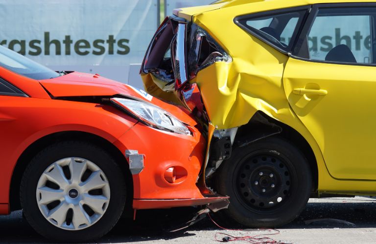 Orange and Yellow Car in a Crash