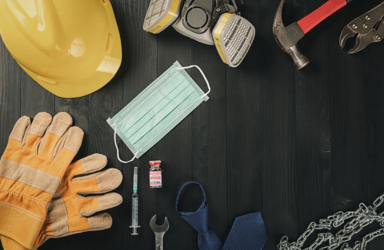 Hardhat, Tools and Medical Equipment on a Table