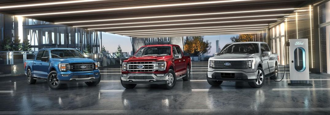 Blue, Red and Silver Ford F-150 Models in a Garage