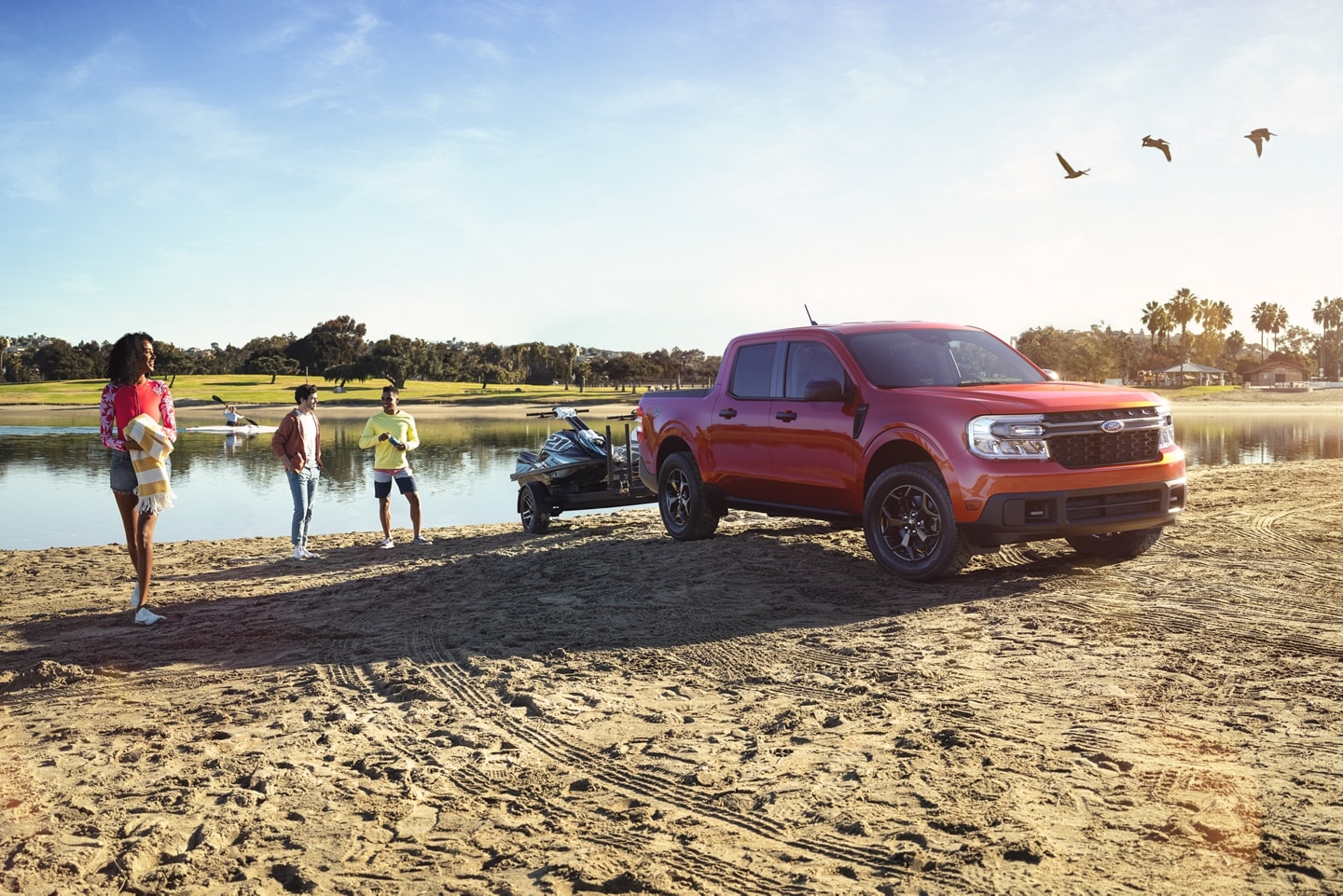 2022 Ford Maverick towing jet skis on the beach 