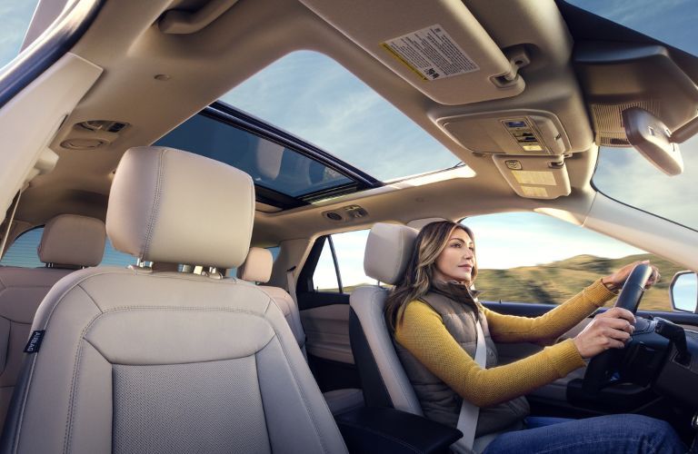 Woman Driving a 2023 Ford Explorer with Moonroof