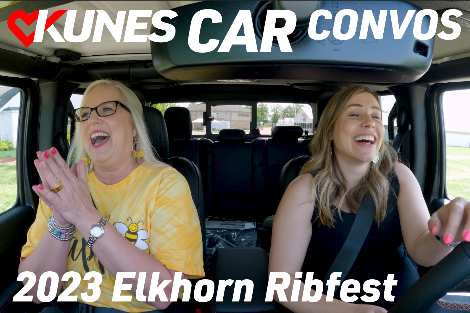 Text: Kunes Car Convos 2023 Elkhorn Ribfest; Pictured left to right: Walworth County Fairgrounds Assistant Marketing Director, Melody Judge, and Megan Swaney Tislau, Kunes Auto Group Marketing Director, smiling inside a 2023 Jeep Gladiator Mojave