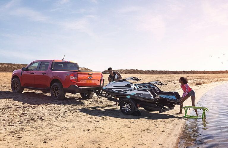 2022 Ford Maverick XLT towing a wave runner out of the water