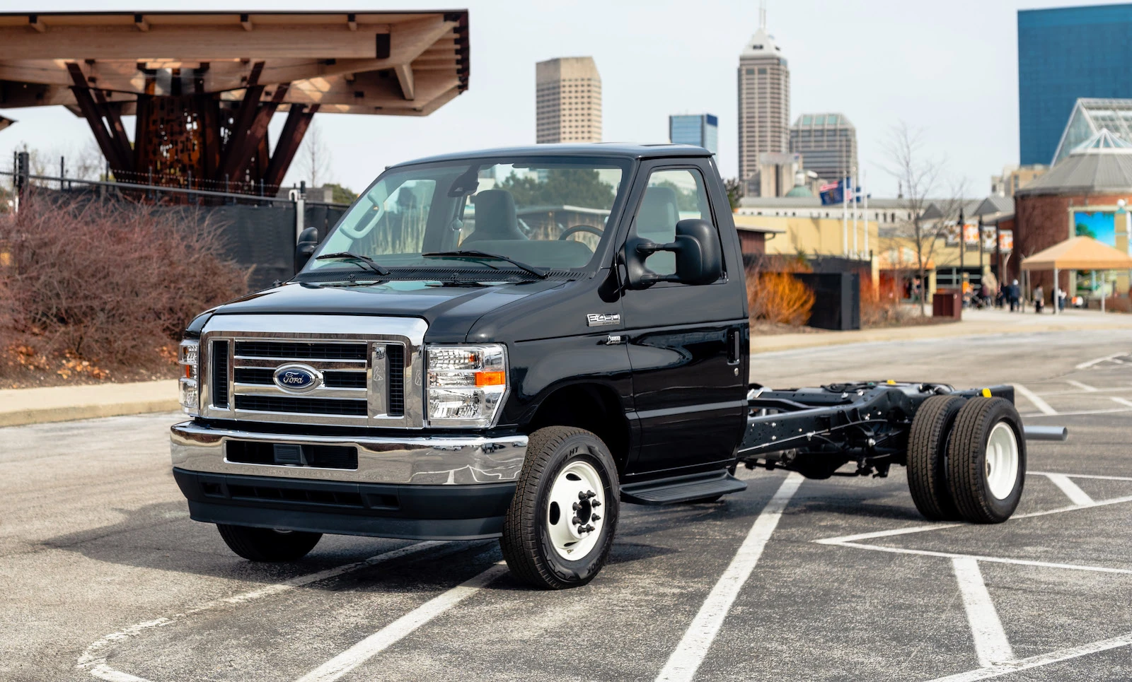 a Ford E450 black base with a city background