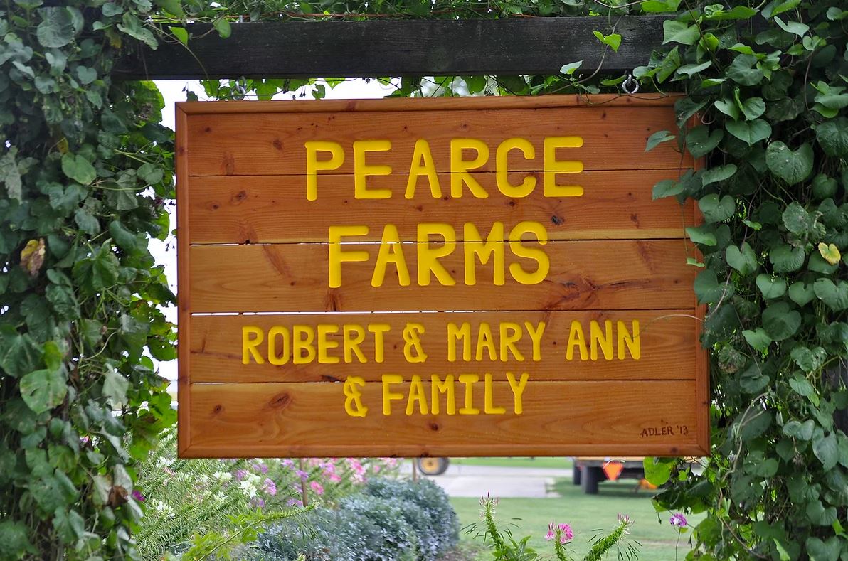 sign for Pearce family farm that says Pearce Farms; Robert & Marry Ann & family