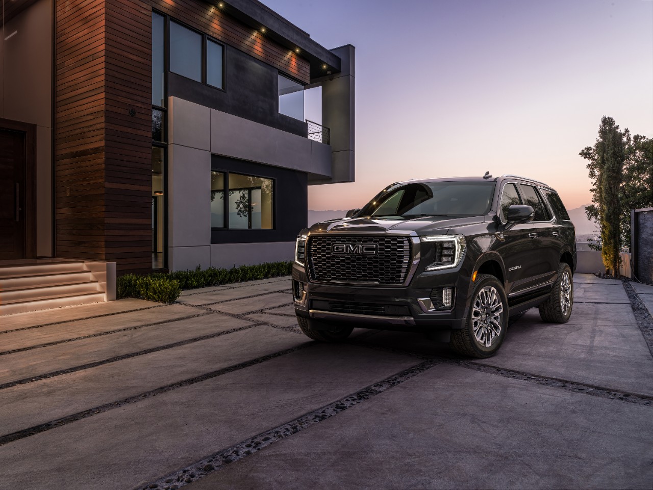 Vader Chrome Yukon Denali in front of house during sunset. 