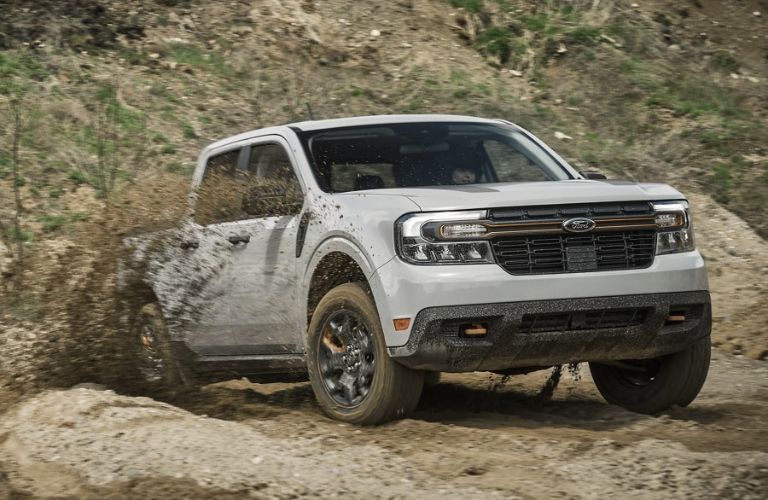 White 2024 Ford Maverick Tremor Splashing in Mud