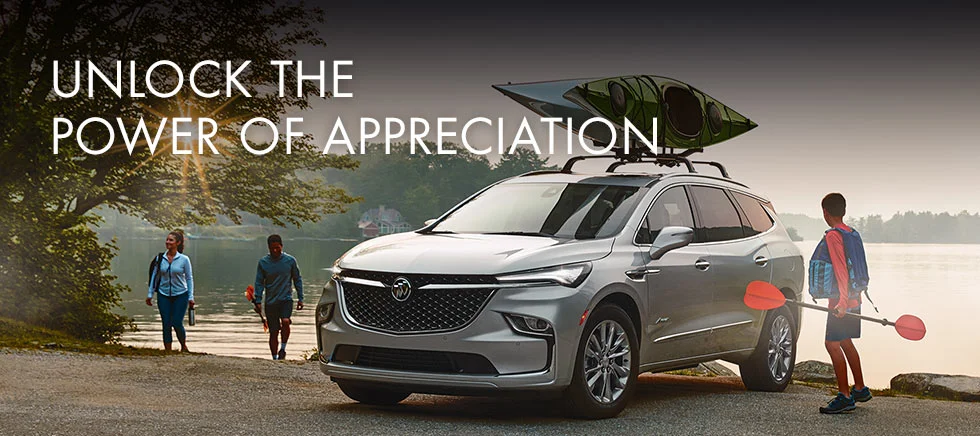 image of a Buick SUV parked on the shore, with two kayaks loaded on top; text reads: unlock the power of appreciation