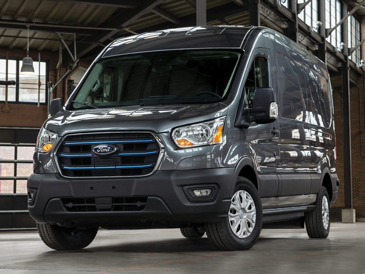 a gray Ford E-Transit 350 in a dark factory 