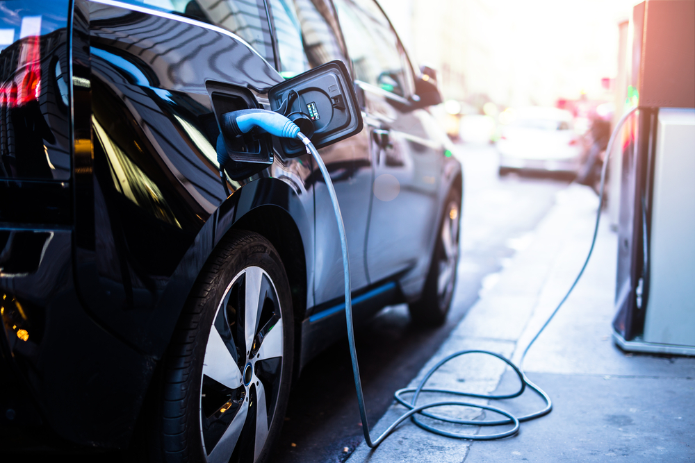 electric vehicle plugged into a charging station