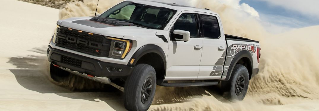 White 2024 Ford F-150 Raptor R Kicking Up Sand in the Desert