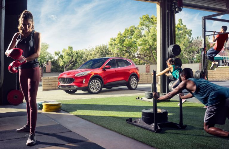 Red 2020 Ford Escape Parked Outside a Gym