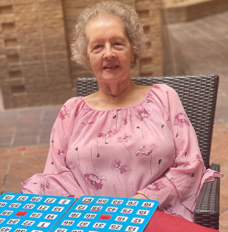A senior resident playing bingo.