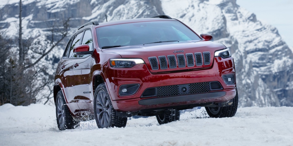 Red Jeep Cherokee in snow 