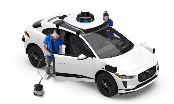 Team cleaning Waymo vehicle
