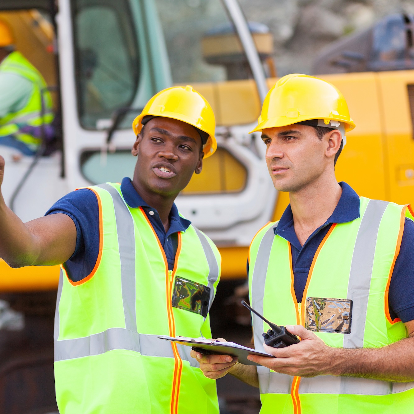 co-workers talking at construction site