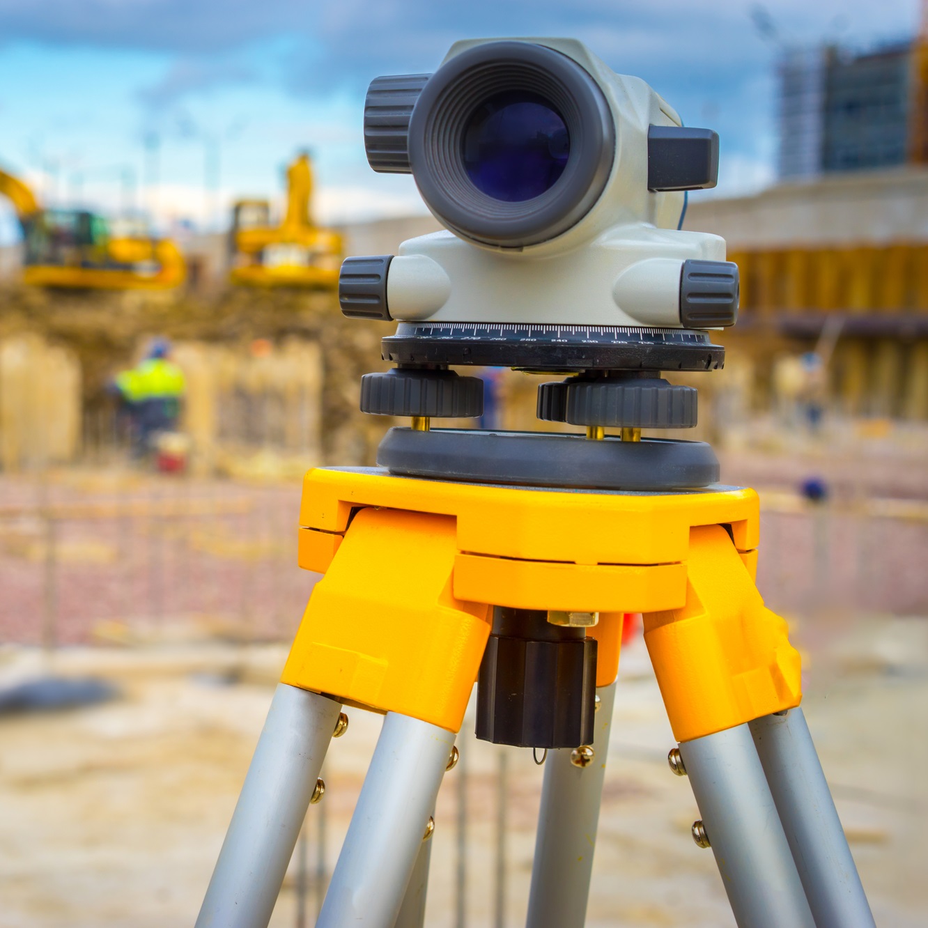 Construction site. Geodesy. Optical level. Electronic theodolite.