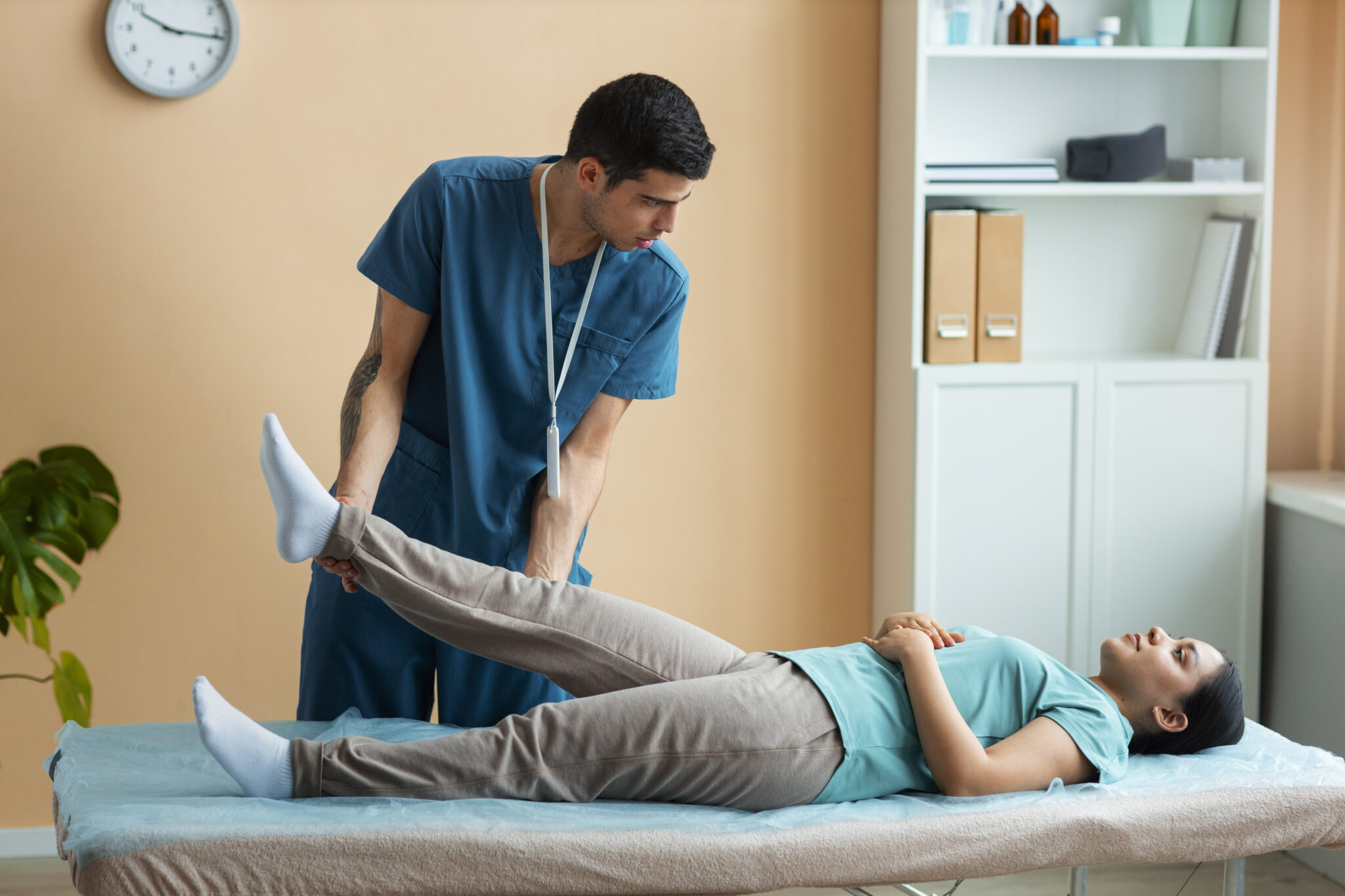doctor-helping-patient-rehabilitation Doctor Gives Phsiotherpy
